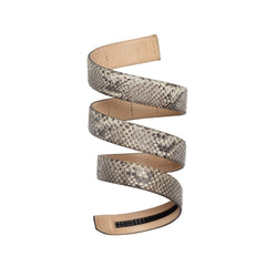 Snakeskin-patterned belt coiled on a white background